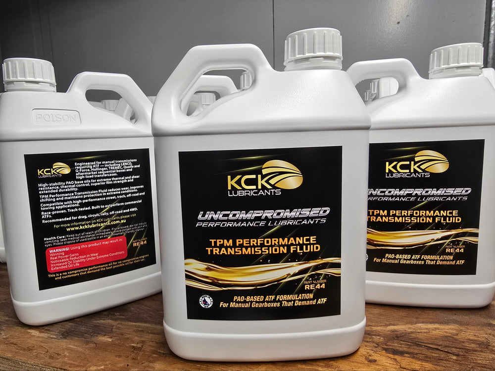 Bottles of KCK RE44 TPM Performance Transmission Fluid